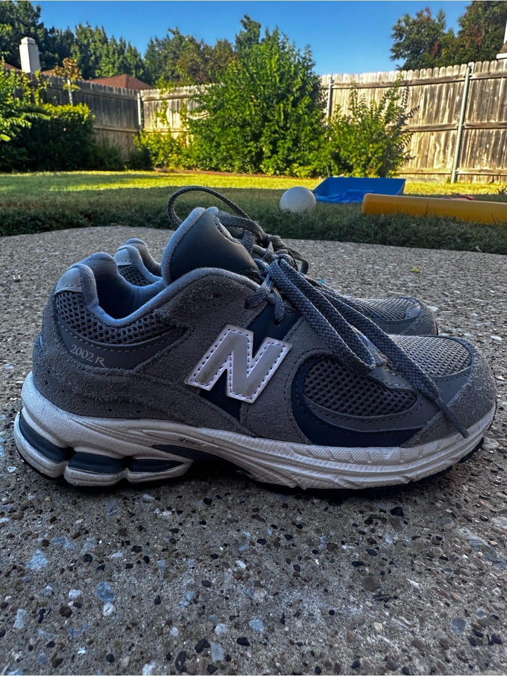 New Balance Kids Gray and White Sneakers